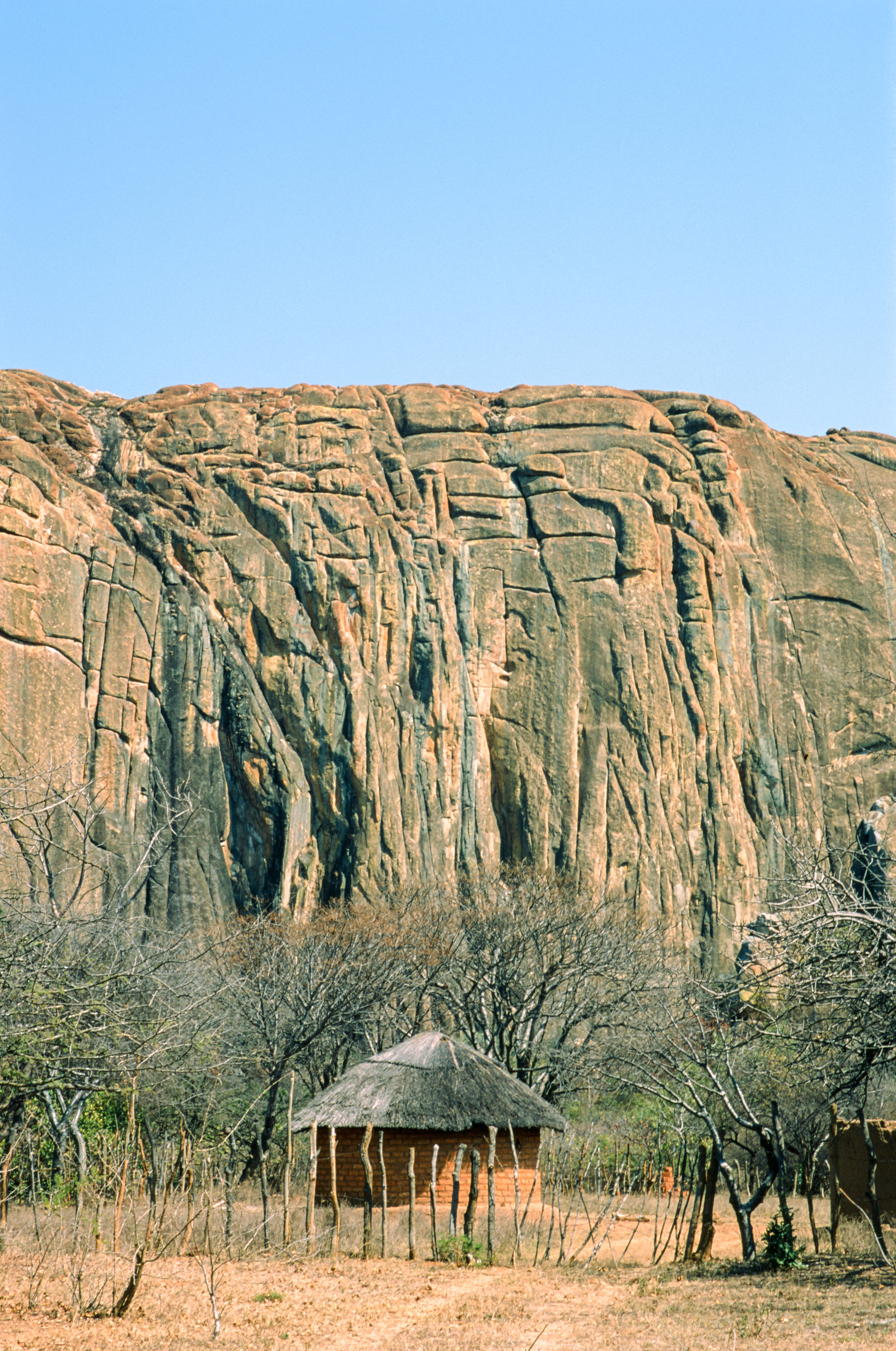 The 180m Hambushaba Wall in Zimbabwe, Southern
	   Africa. Jakob and I did a very fun all-trad first ascent
	   through the fork crack system on the leften side. (Leica
	   R9, Slide ISO 100)